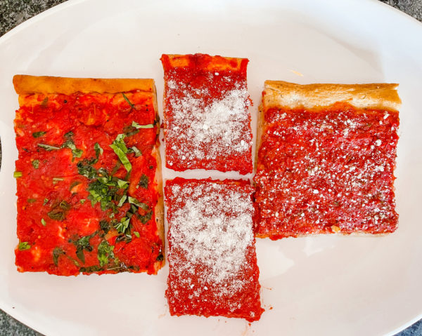 Three different tomato pie slices on plate.