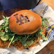 New Dodger Stadium Food for 2026 Chicken sandwich in a bun marked with LA Dodgers logo.