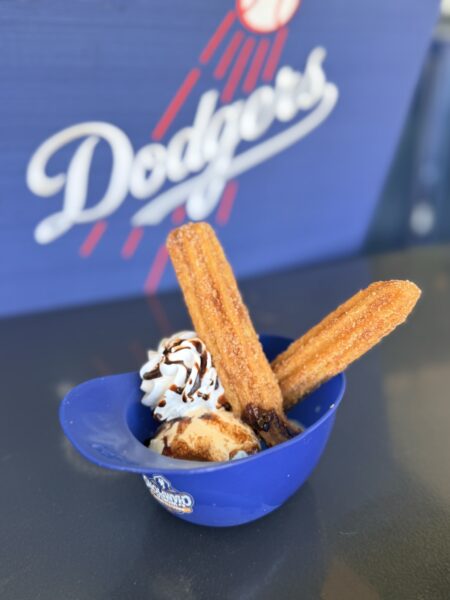 Churros and ice cream served in plastic Dodgers baseball helmet.