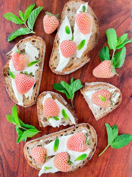 Pineberries with Burrata and Mint on Toast.