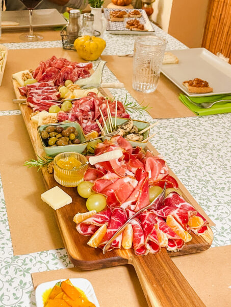 Colorful charcuterie board on table.