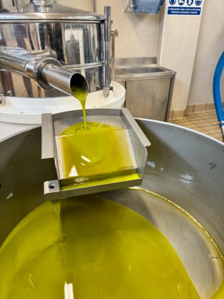 Olive oil running out of the machine. 
