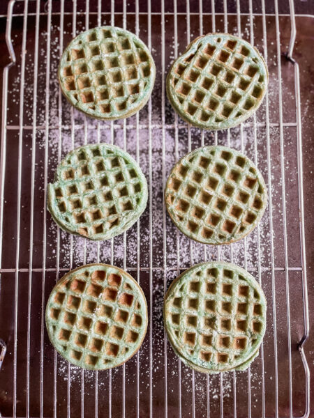 Overhead view of waffles on cooling rack.