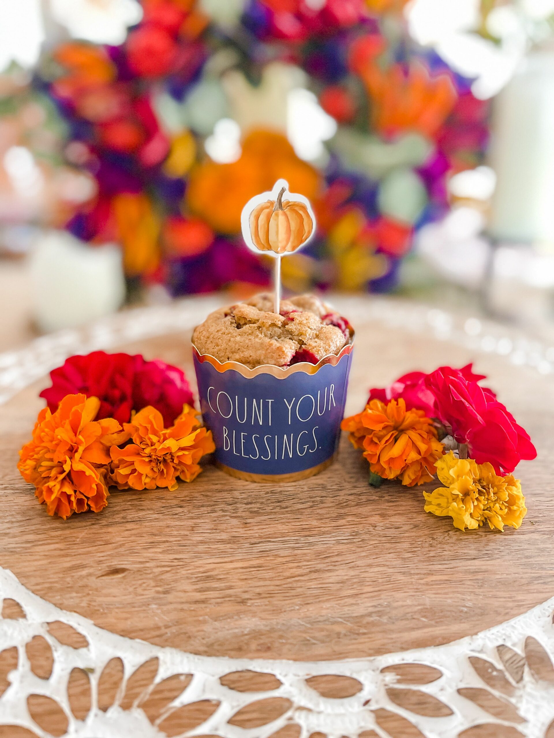 Count your blessings muffin with flowers.