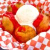 OC Fair Food 2021 – Colorful, Spicy, and Wacky Chicken Charlie's Deep-Fried Brownies with Buffalo Sauce