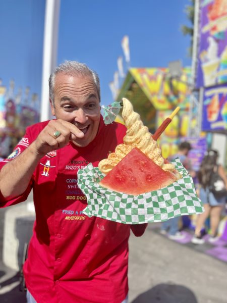 Dominic Palmieri pointing to a Dole Whip Taco