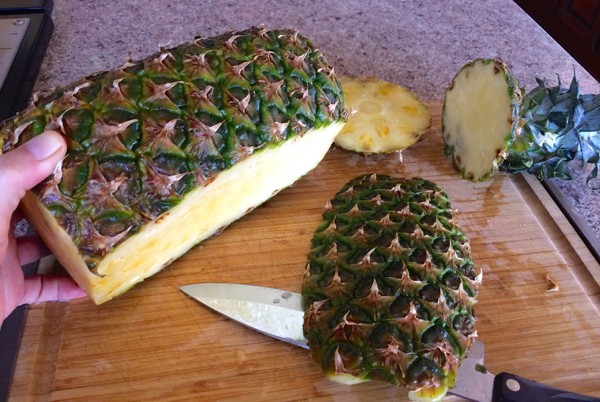 Here's the pineapple with the ends cut off and the slice taken off the bottom.