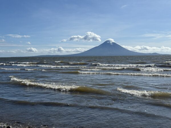 Lake view with volcano on horizon.